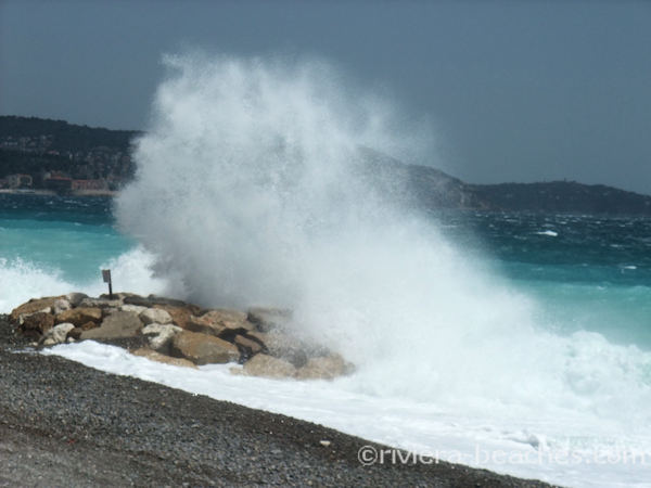 Waves crashing against Nice jetties
